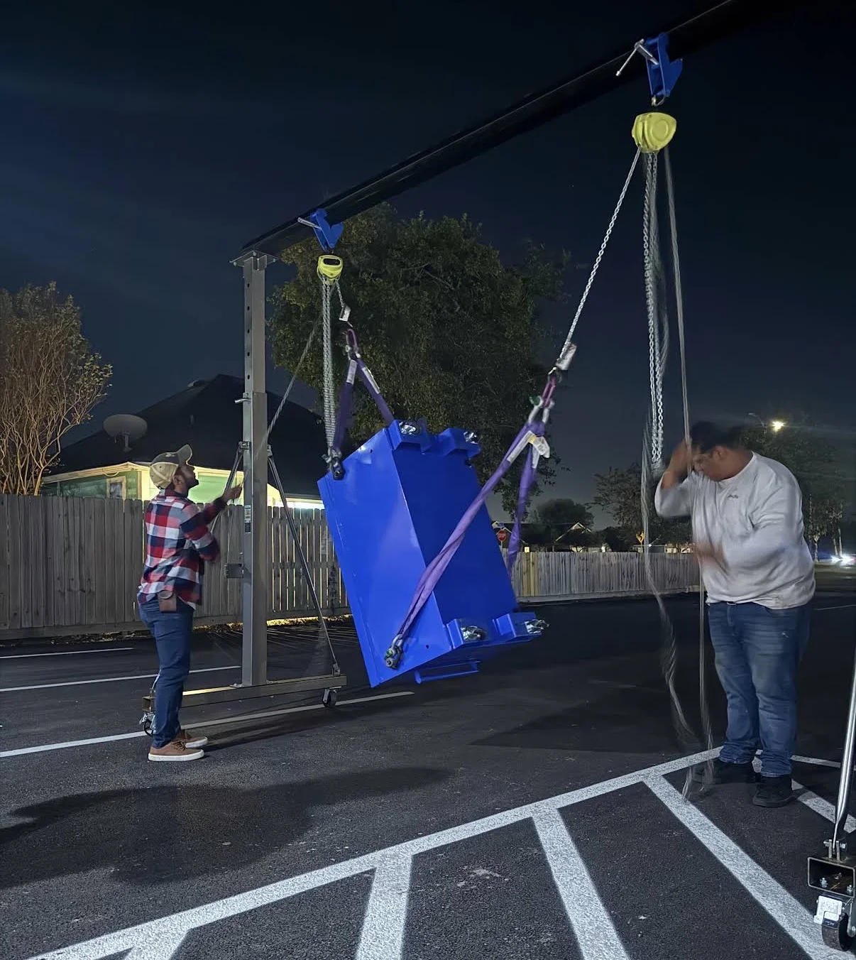 Rig Right Texas students practicing hands-on rigging with chain hoists and slings