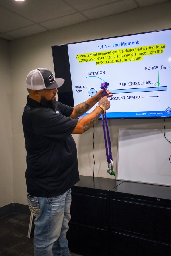 Mike Sanchez teaching students how to inspect a sling during Advanced Rigger training